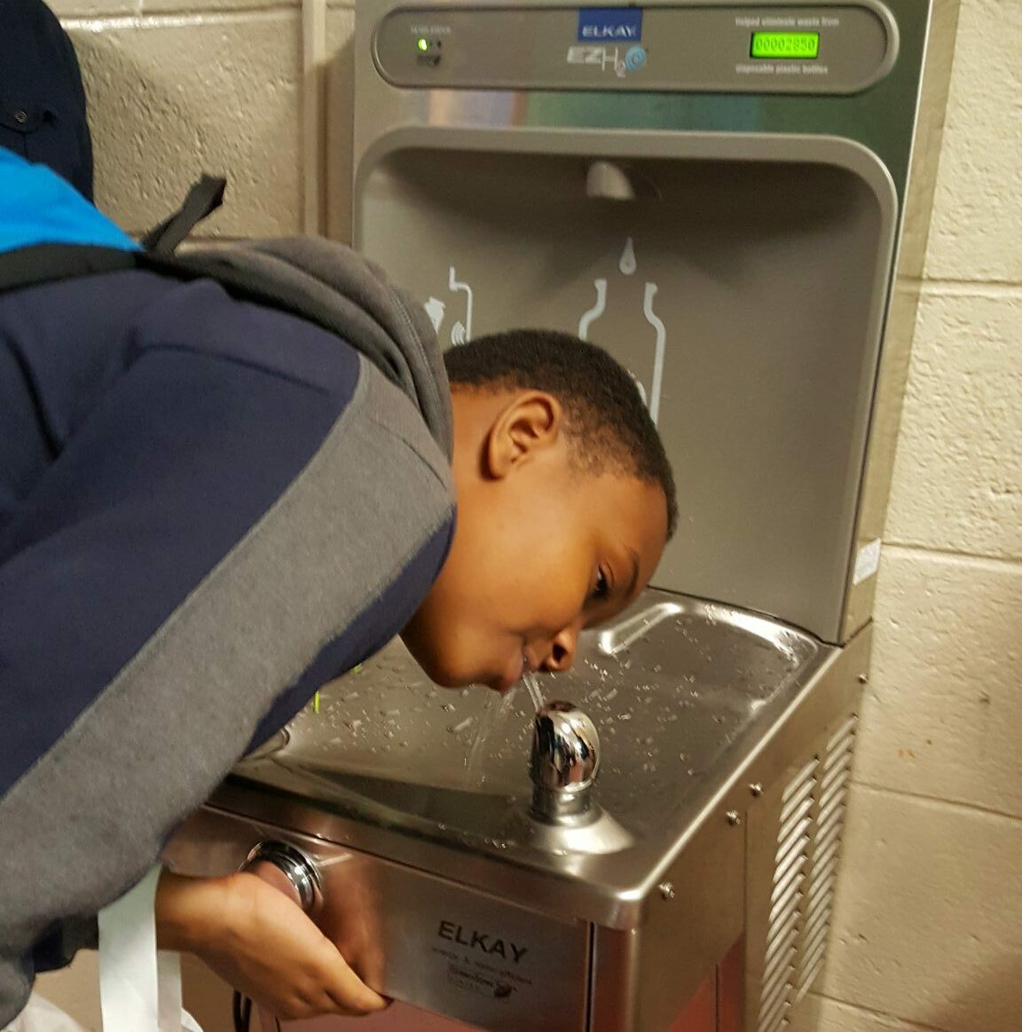 Boy drinking from hydration station