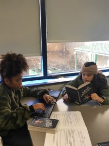 Students reading Star Crossed