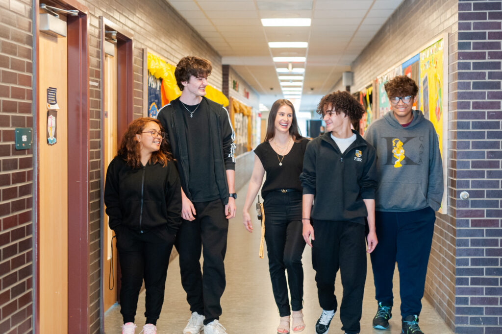 High School Students Walking down the hall way